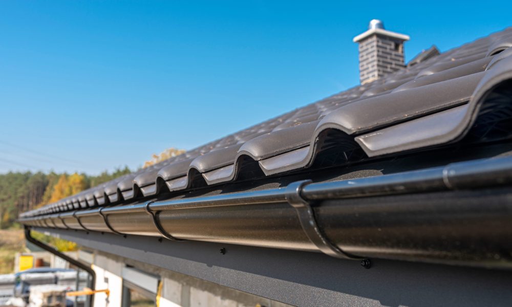 a-metal-black-gutter-on-a-roof-covered-with-ceram-2026-03-24-09-02-20-utc (1)
